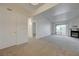 Bright and airy living room boasts plush carpets, access to the balcony, and an open layout to the other living areas at 950 Seven Hills Dr # 1921, Henderson, NV 89052