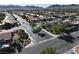 Scenic aerial view captures homes with pools, landscaped streets, and lush greenery at 1006 Winding Hill St, Henderson, NV 89002