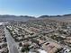 Aerial view of a vibrant suburban community with manicured streets, landscaping, and various housing at 1006 Winding Hill St, Henderson, NV 89002