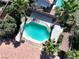 Backyard aerial view shows a private fenced pool and lush landscaping creating a backyard oasis at 1006 Winding Hill St, Henderson, NV 89002