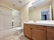 Bathroom with tile floors, tub-shower combo, and a large vanity with ample storage at 1006 Winding Hill St, Henderson, NV 89002