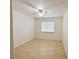 Bright empty bedroom featuring hardwood floors, a ceiling fan, and a window with blinds at 1006 Winding Hill St, Henderson, NV 89002