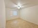 Empty bedroom featuring hardwood floors, a ceiling fan, and a window with blinds at 1006 Winding Hill St, Henderson, NV 89002