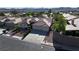 Aerial view of a single-Gathering home featuring a three-car garage and desert landscaping at 1006 Winding Hill St, Henderson, NV 89002