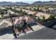 Aerial view of a well-kept single-Gathering house with desert landscaping and a fenced yard at 1006 Winding Hill St, Henderson, NV 89002