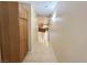 Hallway with wood floors, light-colored walls, and built-in cabinets, leading to the kitchen at 1006 Winding Hill St, Henderson, NV 89002