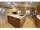 Spacious kitchen featuring a large island with cooktop, granite countertops, and ample cabinet space at 1006 Winding Hill St, Henderson, NV 89002