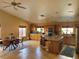 Open-concept kitchen with dining area, featuring stainless steel appliances and a kitchen island at 1006 Winding Hill St, Henderson, NV 89002