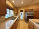 Spacious kitchen with stainless steel appliances, granite countertops, and a view of the pool at 1006 Winding Hill St, Henderson, NV 89002