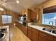 Modern kitchen featuring stainless appliances, granite counters, and a built-in oven and microwave at 1006 Winding Hill St, Henderson, NV 89002
