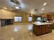 Open kitchen with island, granite countertops, stainless appliances, and ample cabinet space at 1006 Winding Hill St, Henderson, NV 89002