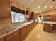 Granite countertops, stainless steel appliances, and an island highlight the spacious kitchen at 1006 Winding Hill St, Henderson, NV 89002