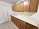 Spacious laundry room featuring ample counter space, cabinets, and a sink at 1006 Winding Hill St, Henderson, NV 89002