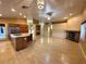 Open floor plan living area with an island kitchen, fireplace, and natural light throughout at 1006 Winding Hill St, Henderson, NV 89002