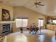 Inviting living room features a cozy fireplace, dining area, and plenty of natural light at 1006 Winding Hill St, Henderson, NV 89002