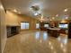 Spacious living room with hardwood floors, fireplace and open kitchen with island at 1006 Winding Hill St, Henderson, NV 89002