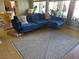 Cozy living room featuring a stylish rug and comfortable blue sofa at 1006 Winding Hill St, Henderson, NV 89002