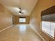 Comfortable living room with bright windows, neutral walls, and wood flooring at 1006 Winding Hill St, Henderson, NV 89002