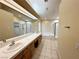 Large main bathroom with double sinks, a bathtub, shower, and tile flooring at 1006 Winding Hill St, Henderson, NV 89002
