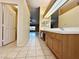 Open main bathroom with double sink vanity and view into living space at 1006 Winding Hill St, Henderson, NV 89002