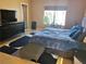 Main bedroom with stylish bed, natural light, dark dresser, and wood flooring at 1006 Winding Hill St, Henderson, NV 89002