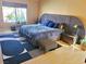 Main bedroom featuring stylish decor, a large bed, and natural light from the window at 1006 Winding Hill St, Henderson, NV 89002
