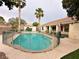 Backyard pool area, enclosed with a safety fence and mature palm trees at 1006 Winding Hill St, Henderson, NV 89002