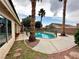 The pool has palm trees and stone surrounding it at 1006 Winding Hill St, Henderson, NV 89002
