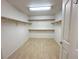 Walk-in closet with wood floors, shelves, and ample storage space at 1006 Winding Hill St, Henderson, NV 89002