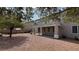 A backyard featuring desert landscaping, a patio, and a view of the home's exterior at 10066 Golden Bluff Ave, Las Vegas, NV 89148