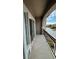 Outdoor balcony features a wrought iron railing and sliding glass doors at 10066 Golden Bluff Ave, Las Vegas, NV 89148