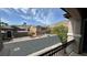 View from balcony overlooking houses, street and mountains in the distance at 10066 Golden Bluff Ave, Las Vegas, NV 89148