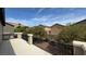 The balcony has black metal railings and views of the neighborhood landscape and blue sky at 10066 Golden Bluff Ave, Las Vegas, NV 89148