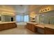 A primary bathroom with double sinks, soaking tub, and tile flooring at 10066 Golden Bluff Ave, Las Vegas, NV 89148