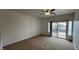 Bright bedroom with a ceiling fan and sliding glass door leading to a balcony at 10066 Golden Bluff Ave, Las Vegas, NV 89148