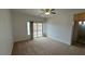 Cozy bedroom featuring neutral carpet and a nearby bathroom entrance at 10066 Golden Bluff Ave, Las Vegas, NV 89148