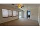 Bedroom featuring plush carpeting, windows, and a sliding door to patio at 10066 Golden Bluff Ave, Las Vegas, NV 89148