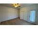 Bedroom with carpeted floors, a ceiling fan and closet doors at 10066 Golden Bluff Ave, Las Vegas, NV 89148