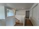 Upstairs hallway with carpet, view of stairs and a bedroom at 10066 Golden Bluff Ave, Las Vegas, NV 89148