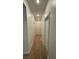Hallway with neutral carpet and white doors at 10066 Golden Bluff Ave, Las Vegas, NV 89148