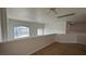 This spacious hallway features neutral carpet and plenty of natural light at 10066 Golden Bluff Ave, Las Vegas, NV 89148