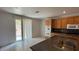 Bright kitchen featuring tile floors, wood cabinets, granite counters, and stainless steel appliances at 10066 Golden Bluff Ave, Las Vegas, NV 89148