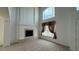 Living room featuring a soaring ceiling, large windows, and a cozy fireplace at 10066 Golden Bluff Ave, Las Vegas, NV 89148