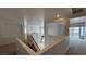 Open loft area features neutral carpeting and views of the stairway and balcony at 10066 Golden Bluff Ave, Las Vegas, NV 89148