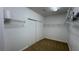 Spacious walk-in closet featuring carpeted floors, and built in shelving offering plenty of storage space at 10066 Golden Bluff Ave, Las Vegas, NV 89148