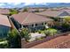 Aerial view of home with backyard covered patio, putting green, and landscaping at 10416 Skye Arroyo Ave, Las Vegas, NV 89166