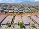 Expansive aerial view of a Primary-planned community featuring single-Gathering homes with desert landscaping and mountain views at 10416 Skye Arroyo Ave, Las Vegas, NV 89166