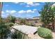 Paver patio in backyard landscaped with desert plants and flowering trees at 10416 Skye Arroyo Ave, Las Vegas, NV 89166