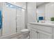 Modern bathroom with glass shower, bright white cabinets, and beautiful tile at 10416 Skye Arroyo Ave, Las Vegas, NV 89166