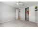 Neutral bedroom features a ceiling fan, closet, carpeted floor, and natural light at 10416 Skye Arroyo Ave, Las Vegas, NV 89166